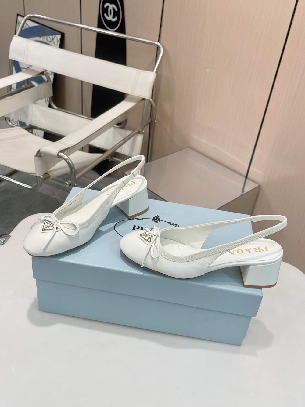 PRADA TRIANGLE LOGO BOW SLINGBACK PUMP IN WHITE - Image 6