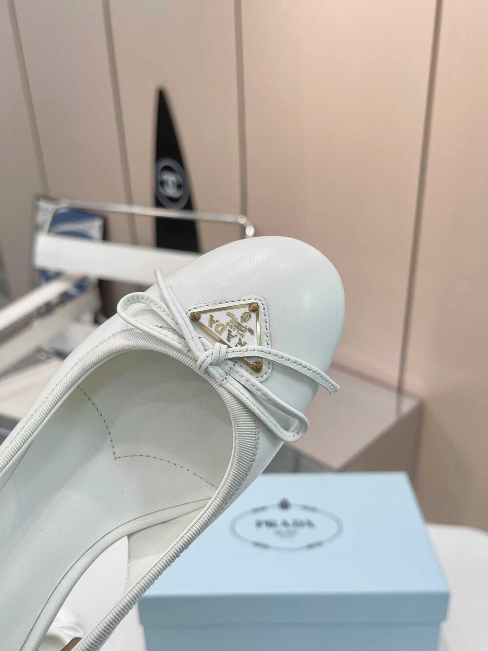 PRADA TRIANGLE LOGO BOW SLINGBACK PUMP IN WHITE - Image 4